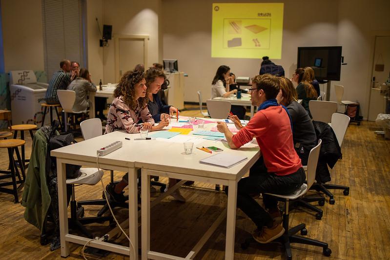 4 People sitting around a table