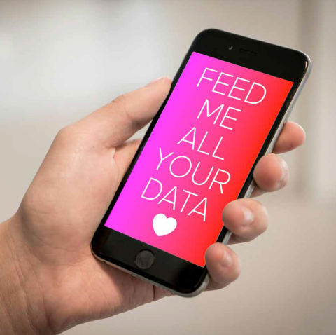A hand holding a phone that says Feed me all your data with a little heart